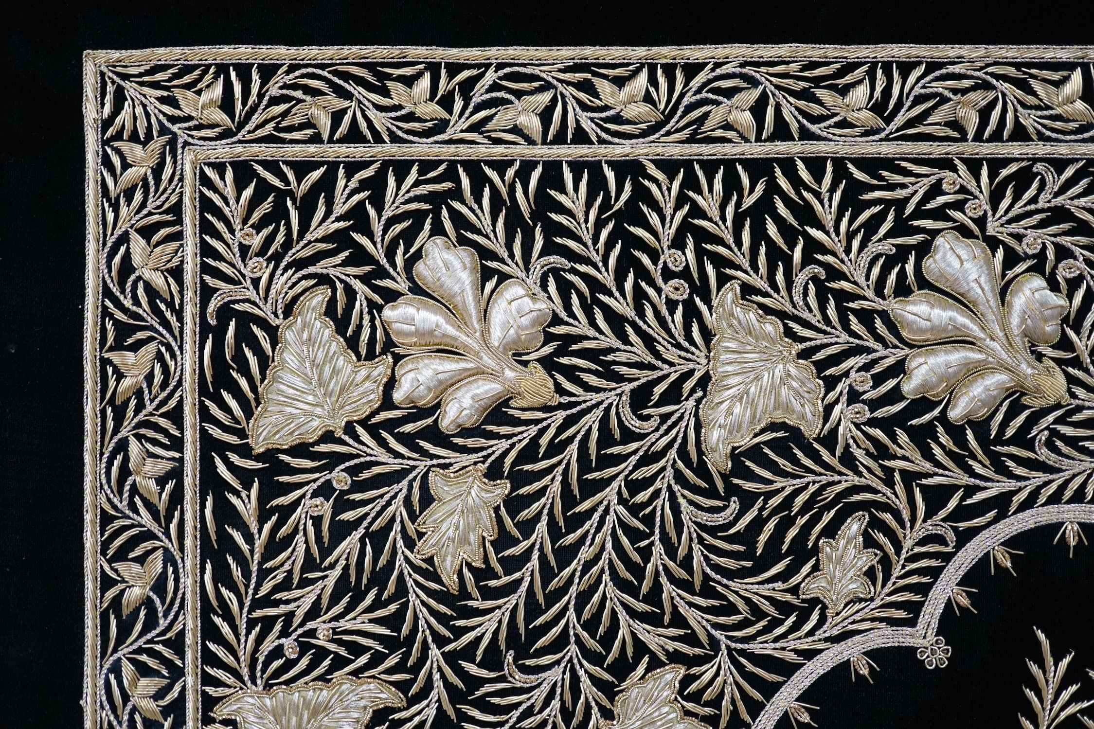 An Indian velvet and gold bullion work panel depicting two peacocks, 85 x 122cm. Condition - good